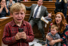 The judge asked the nine-year-old boy which parent he wanted to live with. But when the child slowly reached into his jacket pocket, his rich father’s face turned white and the entire courtroom realized a secret was about to come out.